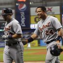 Detroit Tigers' Miguel Cabrera, right, celebrates with teammate Alex Avila after scoring off of Avila's fly to right field during the fifth inning of a baseball game against the Tampa Bay Rays, Sunday, July 1, 2012, in St. Petersburg, Fla. (AP Photo/Brian Blanco)