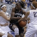 Stanford's Chiney Ogwumike, center, struggles to keep the ball from California's Layshia Clarendon (23) in the first half of an NCAA college basketball game Tuesday, Jan. 8, 2013, in Berkeley, Calif. (AP Photo/Ben Margot)
