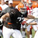 Cleveland Browns tackle Mitchell Schwartz looks to make a block during an NFL football training camp in Berea, Ohio Monday July 30, 2012. (AP Photo/Ron Schwane)