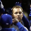Kansas City Royals left fielder Alex Gordon celebrates in the dugout after hitting a three-run home run against the Cleveland Indians in the ninth inning of a baseball game in Cleveland, Wednesday, April 25, 2012. (AP Photo/Amy Sancetta)