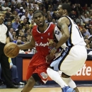 Los Angeles Clippers' Chris Paul, (3) left, moves against Memphis Grizzlies' Mike Conley during the first half of Game 3 in a first-round NBA basketball playoff series, in Memphis, Tenn., Thursday, April 25, 2013. (AP Photo/Danny Johnston)