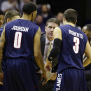 Liberty head coach Dale Layer talks with his team, including guards Jarred Jourdan (0) and Casey Roberts (3), during the second half of an NCAA college basketball game against Georgetown, Wednesday, Nov. 14, 2012, in Washington. Georgetown won 68-59. (AP Photo/Alex Brandon)
