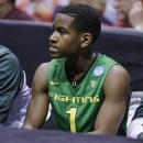 Oregon guard Dominic Artis (1) reacts as he sits in the bench during the second half of a regional semifinal against Louisville in the NCAA college basketball tournament, Friday, March 29, 2013, in Indianapolis. Louisville won 77-69. (AP Photo/Michael Conroy)