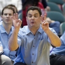 Arizona head coach Sean Miller signals a play for his team in the first half of an NCAA college basketball game in the Diamond Head Classic Sunday, Dec. 23, 2012, in Honolulu. (AP Photo/Eugene Tanner)