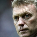 FILE - This is a Wednesday, Jan. 2, 2013 file photo of Everton's manager David Moyes  as he looks on ahead of their English Premier League soccer match against Newcastle United at St James' Park, Newcastle, England. Everton manager David Moyes  and Real Madrid coach Jose Mourinho  are the two clear favorites, to succeed Alex Ferguson who will retire as Manchester United's manager at the end of the current season . The announcement of Ferguson's retirement was made on Wednesday May 8, 2013.  (AP Photo/Scott Heppell, File)