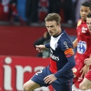 FILE - In this May 18, 2013, file photo, Paris Saint Germain's David Beckham dribbles the ball during a French League One soccer match against Brest at Parc des Princes Stadium in Paris. A person with knowledge of the situation says Beckham has chosen Miami to start a Major League Soccer franchise. The former England captain will ask the MLS to approve the ownership option in his league contract when he joined the Los Angeles Galaxy in 2007. (AP Photo/Jacques Brinon, File)