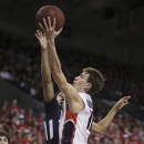 Gonzaga's David Stockton, front, attempts a layup against San Diego's Christopher Anderson during the first half of an NCAA basketball game in Spokane, Wash., on Saturday, Feb. 23, 2013. (AP Photo/Young Kwak)