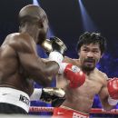 Manny Pacquiao, right, from the Philippines, and Timothy Bradley, from Palm Springs, Calif., work in the first round of their WBO welterweight title fight Saturday, June 9, 2012, in Las Vegas. (AP Photo/Julie Jacobson)