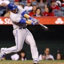 Toronto Blue Jays' J.P. Arencibia hits a three-run home run against the Los Angeles Angels in the third inning of a baseball game in Anaheim, Calif., Thursday, May 3, 2012. (AP Photo/Reed Saxon)