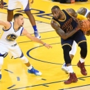 June 2, 2016; Oakland, CA, USA; Cleveland Cavaliers forward LeBron James (23) controls the ball against Golden State Warriors  Stephen Curry (30) and forward Andre Iguodala (9) during the first half in game one of the NBA Finals at Oracle Arena. Mandatory Credit: Bob Donnan-USA TODAY Sports
