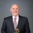 DENVER, CO - MAY 8: Head Coach George Karl of the Denver Nuggets poses for a photo with the Red Auerbach Trophy after being named 2012-2013 NBA Coach of the Year on May 8, 2013 at the Pepsi Center in Denver, Colorado. (Photo by Garrett W. Ellwood/NBAE via Getty Images)