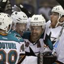 San Jose Sharks' Martin Havlat, right, of the Czech Republic, is congratulated by teammates after scoring the game-winning goal during the second overtime of Game 1 of an NHL hockey first-round playoff series against the St. Louis Blues, Thursday, April 12, 2012, in St. Louis. (AP Photo/Jeff Roberson)