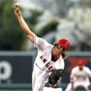 Los Angeles Angels starter Jered Weaver delivers a pitch against the Texas Rangers during the first inning of a baseball game in Anaheim, Calif., Friday, July 20, 2012. (AP Photo/Alex Gallardo)