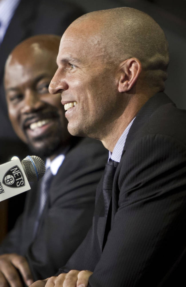 Brooklyn Nets general manger Billy King, left, smiles as head coach Jason Kidd speaks after Kidd was introduced as the team's new coach during an NBA basketball news conference Thursday, June 13, 2013, in New York