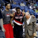 Portland Trail Blazers guard Wesley Matthews (2) is helped off the court after being injured in the first half of an NBA basketball game against the New Orleans Hornets in New Orleans, Wednesday, Feb. 13, 2013. (AP Photo/Gerald Herbert)