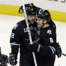 San Jose Sharks center Joe Pavelski (8) celebrates his goal with teammate Patrick Marleau (12) during the third period of Game 4 of their first-round NHL hockey Stanley Cup playoff series in San Jose, Calif., Tuesday, May 7, 2013.  San Jose won 4-3 in overtime. (AP Photo/Marcio Jose Sanchez)