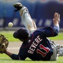 Minnesota Twins right fielder Ben Revere misplays a foul ball hit by Detroit Tigers' Jhonny Peralta during the seventh inning of a baseball game at Comerica Park in Detroit, Sunday, Sept. 23, 2012. (AP Photo/Carlos Osorio)