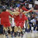 Louisville players including Cortnee Walton (13) celebrate after a national semifinal against California at the Women's Final Four of the NCAA college basketball tournament, Sunday, April 7, 2013, in New Orleans. Louisville won 64-57. (AP Photo/Dave Martin)