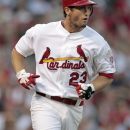 St. Louis Cardinals' David Freese runs to first on an RBI-single during the first inning of a baseball game against the San Diego Padres, Wednesday, May 23, 2012, in St. Louis. (AP Photo/Jeff Roberson)