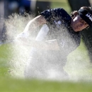 Phil Mickelson hits from a fairway bunker on the fifth hole during the first round of the Humana Challenge golf tournament at the La Quinta Country Club in La Quinta, Calif.,  Thursday, Jan. 17, 2013. (AP Photo/Chris Carlson)