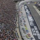 Drivers head to the corner on the first lap of the NASCAR Sprint Cup Series auto race Saturday, Aug. 25, 2012, in Bristol, Tenn. (AP Photo/Mark Humphrey)