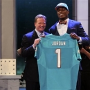 Dion Jordan, a defensive end from Oregon, stands with NFL Commissioner Roger Goodell after being selected third overall by the Miami Dolphins in the first round of the NFL football draft, Thursday, April 25, 2013, at Radio City Music Hall in New York. (AP Photo/Mary Altaffer)