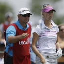 Jessica Korda talks with her caddie Jason Gilroyed, left, before hitting a tee shot on the first hole during the third round of the U.S. Women's Open golf tournament at the Sebonack Golf Club Saturday, June 29, 2013, in Southampton, N.Y. Korda fired her caddie after the ninth hole. (AP Photo/Frank Franklin II)