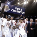 Louisville's Peyton Siva (3) celebrates with teammates after an NCAA college basketball championship game against Syracuse at the Big East Conference tournament, Saturday, March 16, 2013, in New York. Louisville won 78-61. (AP Photo/Frank Franklin II)