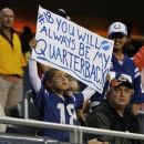 A young fan of Denver Broncos quarterback Peyton Manning holds up a sign before an NFL preseason football game against the Chicago Bears in Chicago, Thursday, Aug. 9, 2012. (AP Photo/Charles Rex Arbogast)