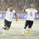 United States forward Clint Dempsey (8) celebrates a goal with Michael Bradley (4) against Costa Rica during the first half of a World Cup qualifier soccer match in Commerce City, Colo., Friday, March 22, 2013. (AP Photo/Jack Dempsey)