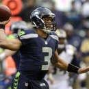 Seattle Seahawks quarterback Russell Wilson passes in the first half of an NFL football game against the St. Louis Rams, Sunday, Dec. 30, 2012, in Seattle. (AP Photo/Elaine Thompson)