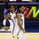Indiana Fever guard Shavonte Zellous, left, congratulates Erlana Larkins on being fouled in the second half of Game 4 of the WNBA basketball Finals against the Minnesota Lynx, Sunday, Oct. 21, 2012, in Indianapolis. (AP Photo/AJ Mast)