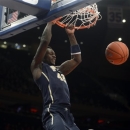 Pitt's Talib Zanna dunks in the first half of an NCAA college basketball game against St. John's at Madison Square Garden in New York, Sunday, Feb. 24, 2013. (AP Photo/Henny Ray Abrams)