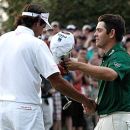 Louis Oosthuizen congratulates Bubba Watson for winning the Masters