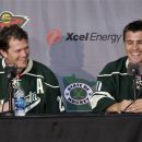New Minnesota Wild NHL hockey players Ryan Suter, left, and Zach Parise are introduced during a news conference Monday, July 9, 2012 in St. Paul, Minn. The two signed 13-year contracts with the Wild for $98 million. (AP Photo/Jim Mone)