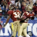 Florida State's James Wilder Jr. (32) celebrates his touchdown run with teammate Lonnie Pryor (24) during the first half of the ACC Championship college football game against Georgia Tech in Charlotte, N.C., Saturday, Dec. 1, 2012. (AP Photo/Mike McCarn)