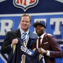 Tavon Austin, from West Virginia, stands with NFL Commissioner Roger Goodell after being selected eighth overall by the Saint Louis Rams in the first round of the NFL football draft, Thursday, April 25, 2013, at Radio City Music Hall in New York. (AP Photo/Jason DeCrow)