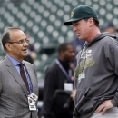 Executive Vice President for Baseball Operations for Major League Baseball, Joe Torre, left, talks with Oakland Athletics manager Bob Melvin before Game 1 of the American League division baseball series against the Detroit Tigers, Saturday, Oct. 6, 2012, in Detroit. (AP Photo/Paul Sancya)