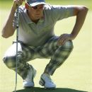 England's Ian Poulter reads a putt on the 13th green during the third round of the PGA Championship at the Wentworth golf club, Virginia Water, England, Saturday May 26, 2012. (AP Photo/Tim Hales)