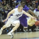 Amherst guard Aaron Toomey, front, and Mary Hardin-Baylor guard Brian Todd vie for a loose ball during the first half of the NCAA college Division lll national championship basketball game on Sunday, April 7, 2013, in Atlanta. (AP Photo/John Amis)