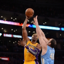 LOS ANGELES, CA - NOVEMBER 30: Dwight Howard #12 of the Los Angeles Lakers shoots against Kosta Koufos #41 of the Denver Nuggets at Staples Center on November 30, 2012 in Los Angeles, California. (Photo by Noah Graham/NBAE via Getty Images)