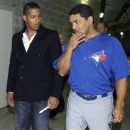 Toronto Blue Jays' Yunel Escobar, left, and coach Luis Rivera leave a news conference at Yankee Stadium in New York, Tuesday, Sept. 18, 2012. Escobar was suspended for three games Tuesday by the Blue Jays for wearing eye-black displaying a homophobic slur written in Spanish during last Saturday's game against the Boston Red Sox. (AP Photo/Kathy Willens)
