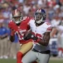 New York Giants free safety Antrel Rolle (26) returns an interception as wide receiver Michael Crabtree (15) chases during the third quarter of an NFL football game in San Francisco, Sunday, Oct. 14, 2012. (AP Photo/Mark J. Terrill)