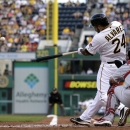 Pittsburgh Pirates' Pedro Alvarez (24) hits a three-run home run off St. Louis Cardinals starting pitcher Jake Westbrook (35) during the first inning of a baseball game in Pittsburgh, Monday, July 29, 2013. (AP Photo/Gene J. Puskar)