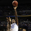 Kentucky guard Archie Goodwin (10) shoots over Vanderbilt's Dai-Jon Parker (24) and Kevin Bright (15) during the first half of an NCAA college basketball game at the Southeastern Conference tournament, Friday, March 15, 2013, in Nashville, Tenn. (AP Photo/Dave Martin)