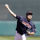 Japan starting pitcher Masahiro Tanaka throws to the San Francisco Giants during the second inning of an exhibition baseball game on Thursday, March 14, 2013, in Scottsdale, Ariz. (AP Photo/Marcio Jose Sanchez)
