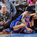 DENVER, CO - MARCH 13: Tyson Chandler #6 of the New York Knicks reacts after bruising his knee during play against the Denver Nuggets on March 13, 2013 at the Pepsi Center in Denver, Colorado. (Photo by Garrett W. Ellwood/NBAE via Getty Images)