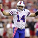 Buffalo Bills quarterback Ryan Fitzpatrick (14) celebrates a touchdown against the Arizona Cardinals during the second half of an NFL football game, Sunday, Oct. 14, 2012, in Glendale, Ariz. (AP Photo/Paul Connors)