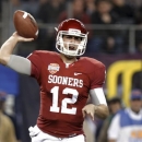 FILE - In this Jan. 4, 2013 file photo, Oklahoma quarterback Landry Jones passes against Texas A&M during the first half of the Cotton Bowl NCAA college football game in Arlington, Texas. (AP Photo/LM Otero, File)