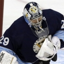 Pittsburgh Penguins goalie Marc-Andre Fleury blocks a shot in first period of an NHL hockey game against the Florida Panthers in Pittsburgh on Friday, Feb. 22, 2013. (AP Photo/Gene J. Puskar)